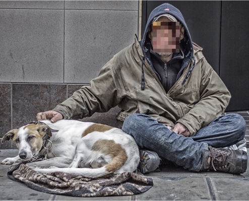 Photograph of homeless man with dog